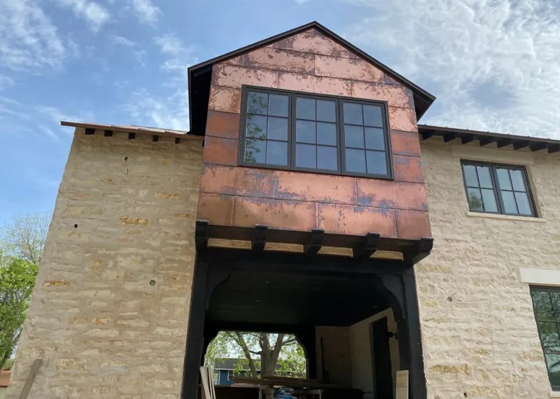 Copper metal panel facade on a stone building for Skylight Installation in Pepper Pike